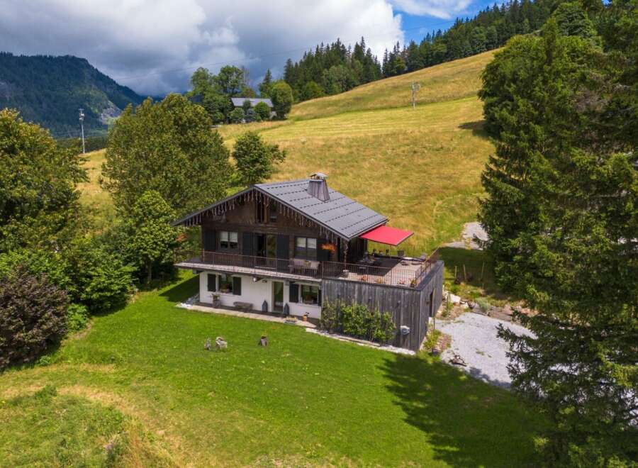 Nestled in a picturesque mountain setting, this stunning property offers a unique blend of rustic charm and modern comfort.