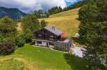 Nestled in a picturesque mountain setting, this stunning property offers a unique blend of rustic charm and modern comfort.