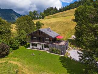 Nestled in a picturesque mountain setting, this stunning property offers a unique blend of rustic charm and modern comfort.