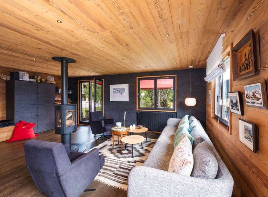 Experience the warmth of this stunning living space, featuring a cozy fireplace and inviting seating areas.