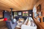 Experience the warmth of this stunning living space, featuring a cozy fireplace and inviting seating areas.