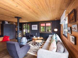Experience the warmth of this stunning living space, featuring a cozy fireplace and inviting seating areas.