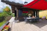 Enjoy the tranquility of this charming wooden cabin with a spacious deck, perfect for outdoor dining and relaxation.