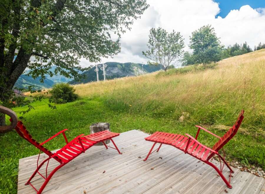 Enjoy the tranquility of this stunning property, featuring a serene outdoor space perfect for relaxation.