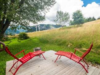 Enjoy the tranquility of this stunning property, featuring a serene outdoor space perfect for relaxation.
