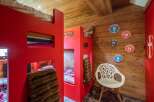 This charming bedroom features a unique bunk bed design, perfect for a cozy and stylish living space.