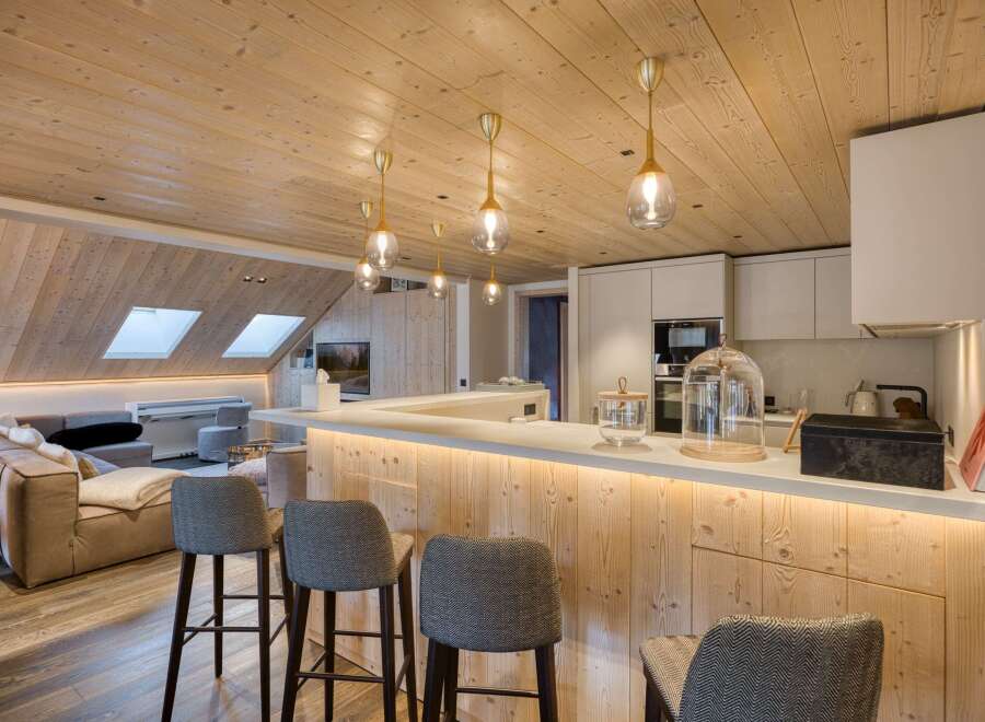 This stunning property features a modern kitchen with a sleek design and high-end appliances.