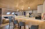 This stunning property features a modern kitchen with a sleek design and high-end appliances.