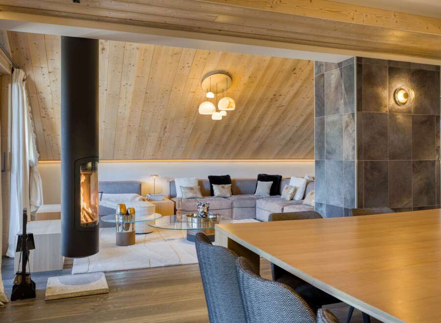 This stunning property boasts a modern living space with a cozy fireplace, perfect for those chilly evenings.
