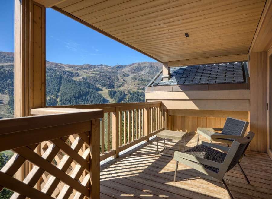 Enjoy breathtaking mountain views from this stunning balcony.