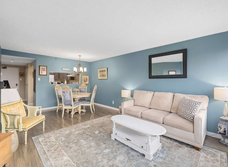 Step into this inviting living space, featuring a cozy sofa and a stylish coffee table, perfect for relaxation and entertaining.
