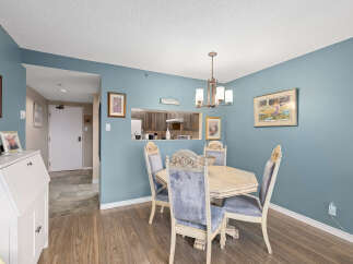 This charming dining area features a stylish table and chairs, perfect for intimate gatherings.