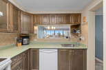 This kitchen features beautiful wooden cabinets and a modern design.