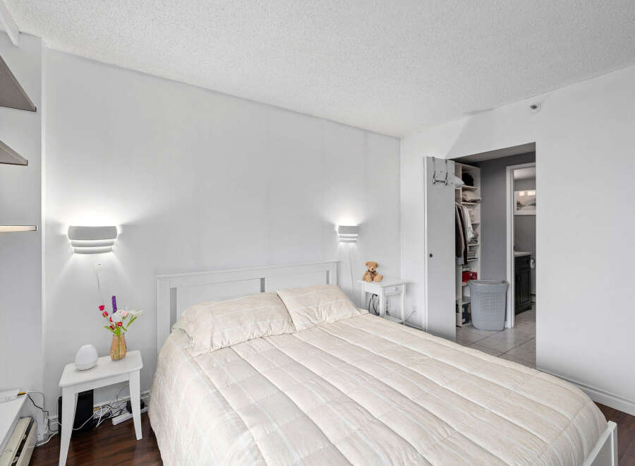 This bright and airy bedroom offers a serene retreat.