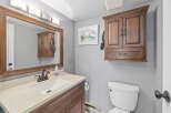 This bathroom features a stylish vanity with a sink and a large mirror, perfect for daily routines.