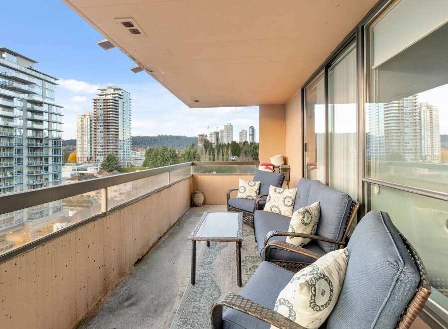 Enjoy breathtaking city views from this stunning balcony.
