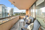 Enjoy breathtaking city views from this stunning balcony.