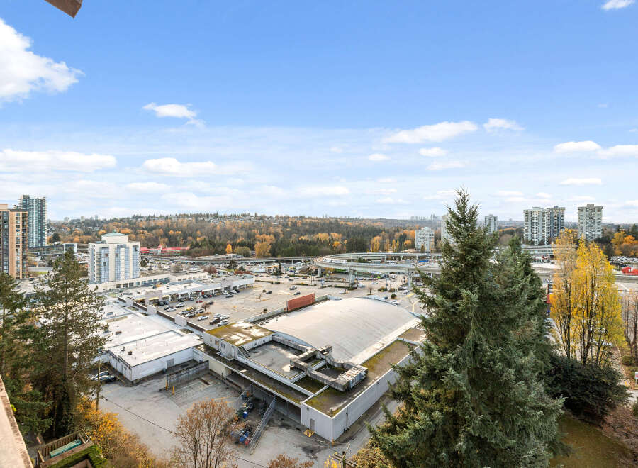 Enjoy stunning views from this property, showcasing a vibrant cityscape and lush greenery.