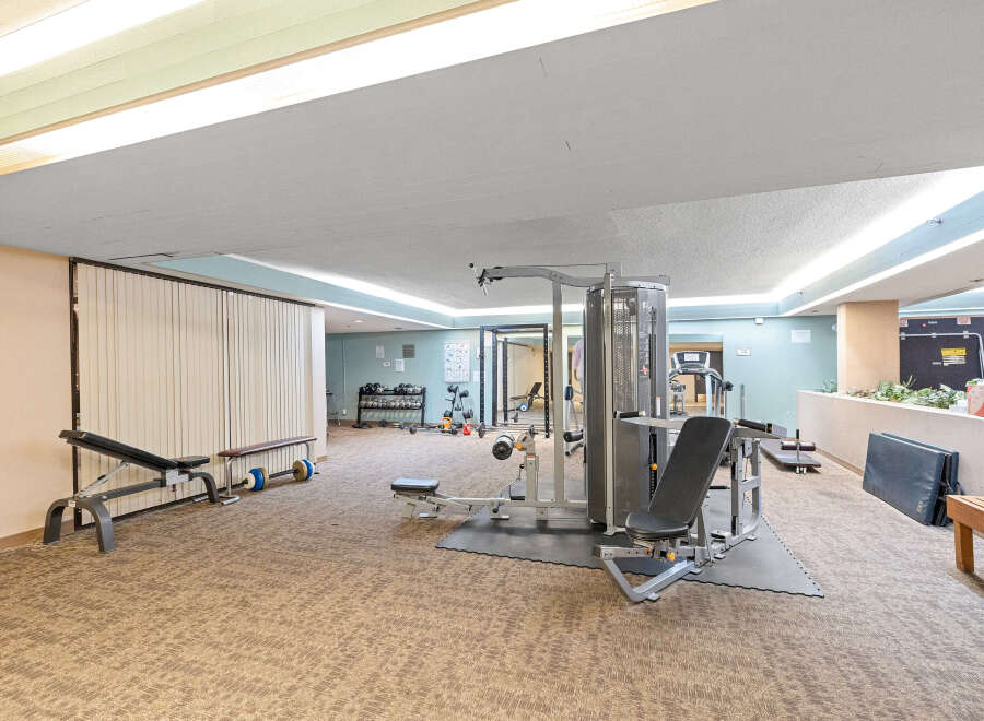 This well-equipped gym offers a variety of workout options for residents.