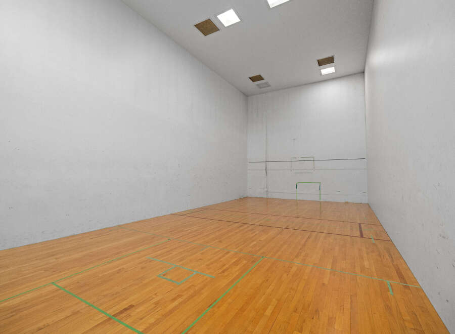 Step into this well-maintained racquetball court, perfect for fitness enthusiasts.