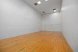 Step into this well-maintained racquetball court, perfect for fitness enthusiasts.
