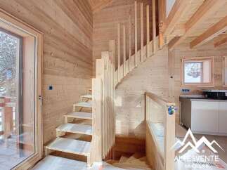 Discover the charm of this stunning wooden staircase, a key feature of this beautifully designed property.