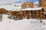 Discover the charm of this stunning ski chalet nestled in a picturesque mountain setting.