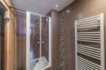 Step into a modern bathroom oasis! This stunning space features a sleek glass shower enclosure, perfect for a refreshing start to your day.