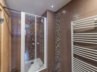 Step into a modern bathroom oasis! This stunning space features a sleek glass shower enclosure, perfect for a refreshing start to your day.