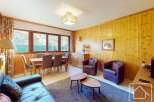This charming property boasts a cozy living space with a dining area, perfect for entertaining.
