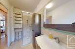 This modern bathroom features a sleek design with a glass shower enclosure and a stylish vanity.