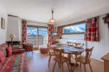 This charming property boasts a cozy living space with a fireplace and a dining area perfect for gatherings.