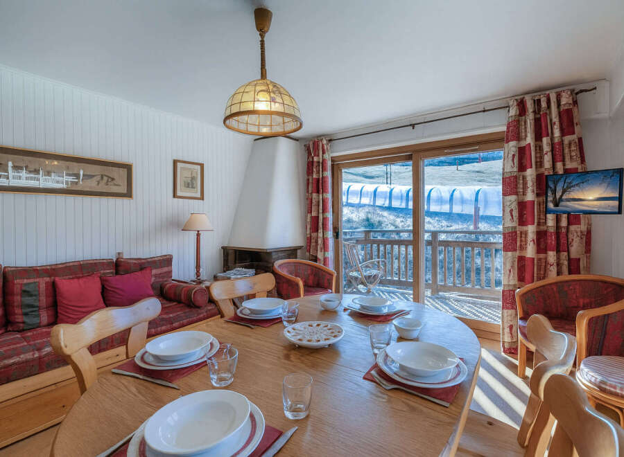 This charming property boasts a cozy dining area, perfect for gatherings.