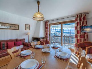 This charming property boasts a cozy dining area, perfect for gatherings.
