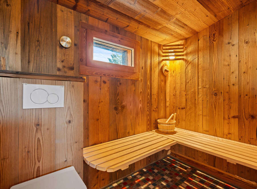 Step into relaxation with this stunning sauna, featuring beautiful wooden interiors and a cozy atmosphere.