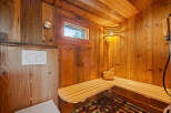 Step into relaxation with this stunning sauna, featuring beautiful wooden interiors and a cozy atmosphere.