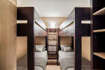 This cozy bedroom features two sets of bunk beds, perfect for accommodating multiple guests or family members.