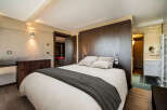 Discover the epitome of luxury in this stunning bedroom, featuring a plush bed and elegant design.
