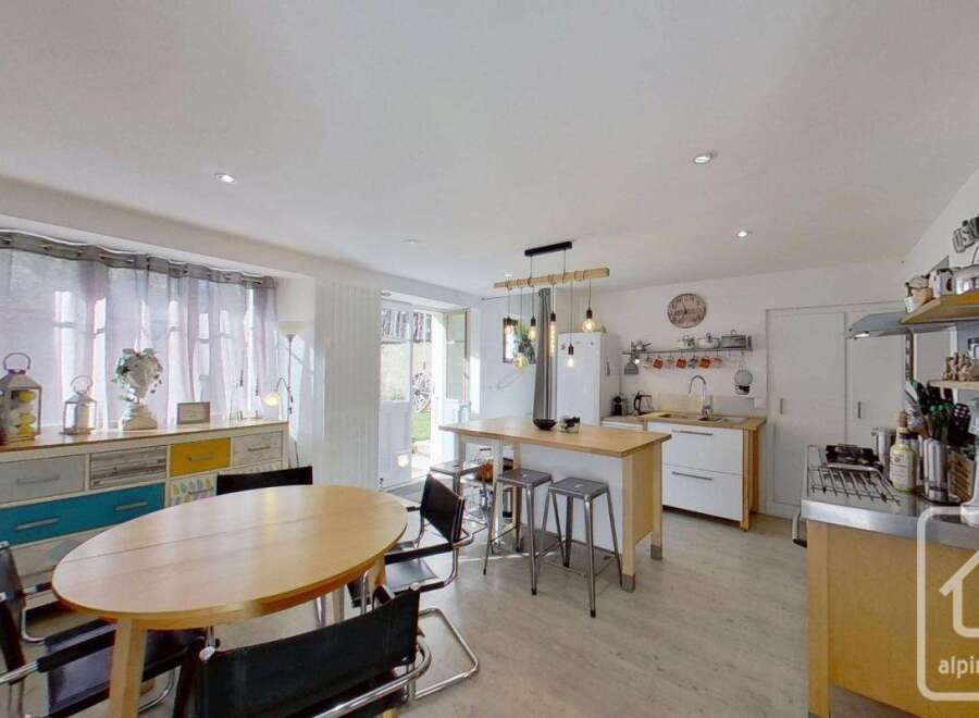 Discover this charming property featuring a modern kitchen with a stylish island and seating.