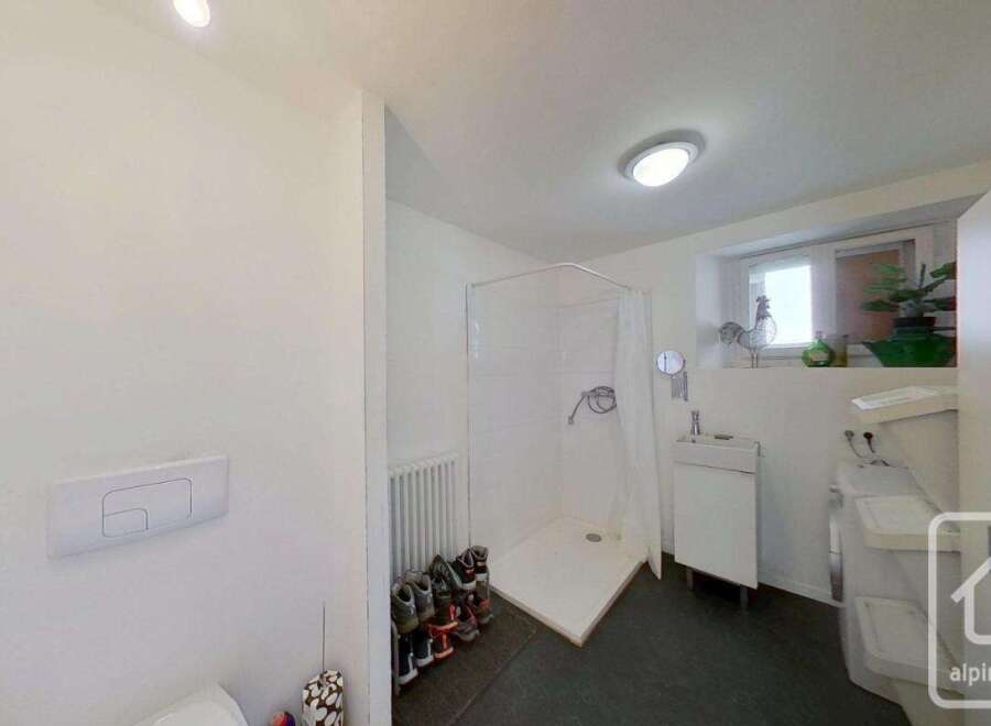 Discover this modern bathroom with a sleek shower and contemporary design.