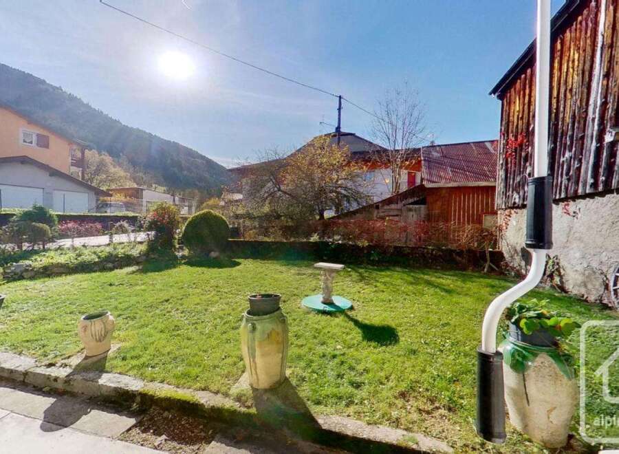 Discover this charming property with a lush green lawn, perfect for outdoor enjoyment.