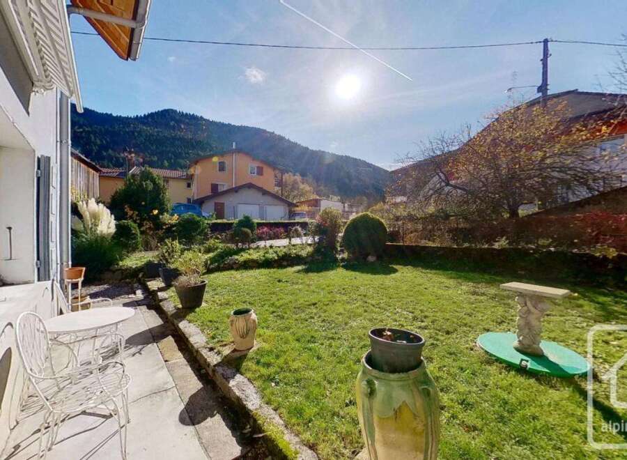 Discover this charming property with a lush green lawn, perfect for outdoor relaxation.