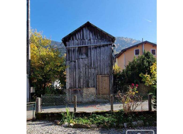 Discover the charm of this unique property! This rustic wooden structure offers a glimpse into a simpler time, with its weathered facade and classic design.