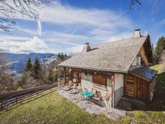 Discover a charming mountain retreat nestled in a picturesque landscape.