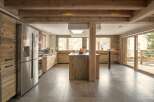 This stunning kitchen boasts a rustic, yet modern design, perfect for a luxurious mountain retreat.