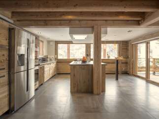 This stunning kitchen boasts a rustic, yet modern design, perfect for a luxurious mountain retreat.