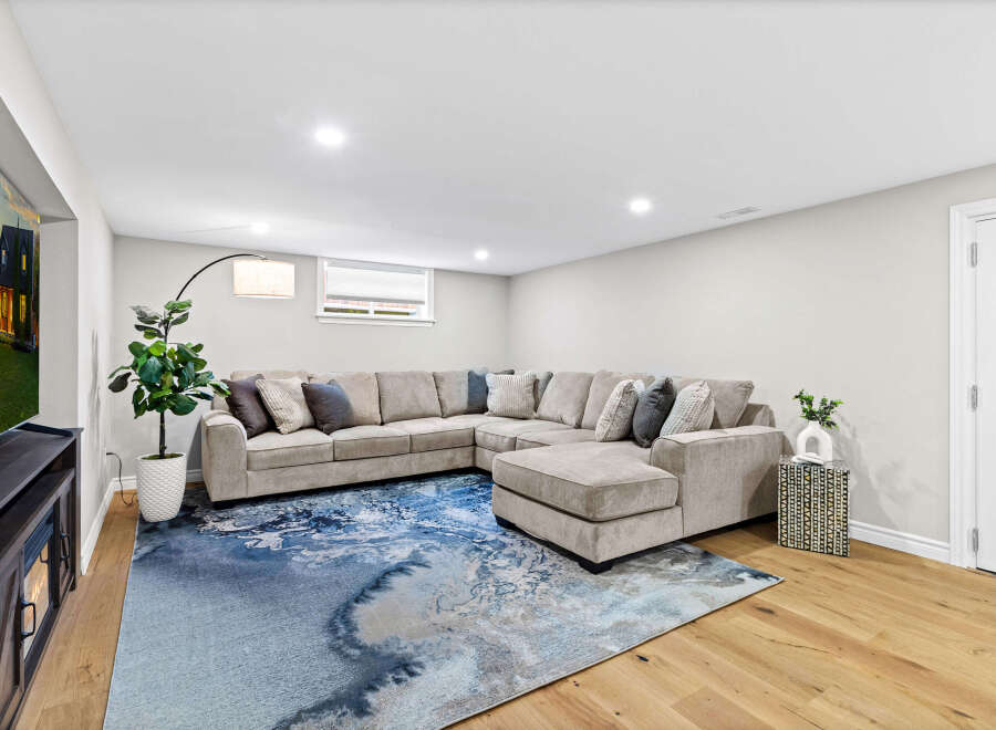 Step into luxury with this stunning living space, featuring a spacious sectional sofa perfect for relaxation.