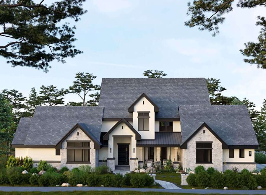 This stunning property showcases a modern architectural design with a blend of stone and sleek lines.