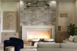 Experience luxury living in this stunning property featuring a cozy fireplace with a stone accent wall, perfect for creating a warm and inviting atmosphere.