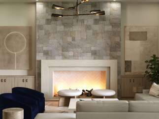 Experience luxury living in this stunning property featuring a cozy fireplace with a stone accent wall, perfect for creating a warm and inviting atmosphere.